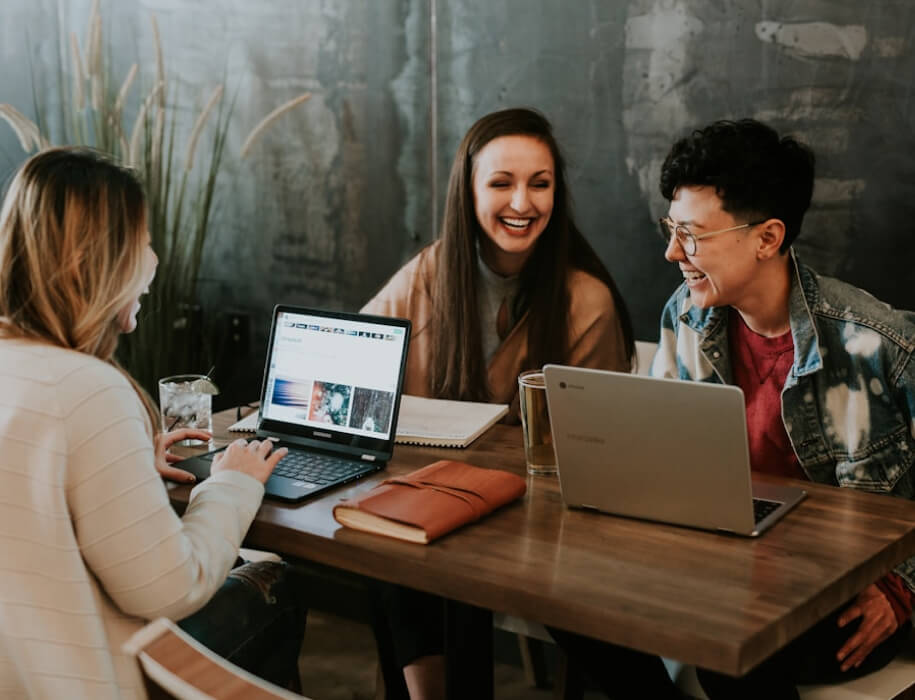 group of young professionals working at a coffee shop